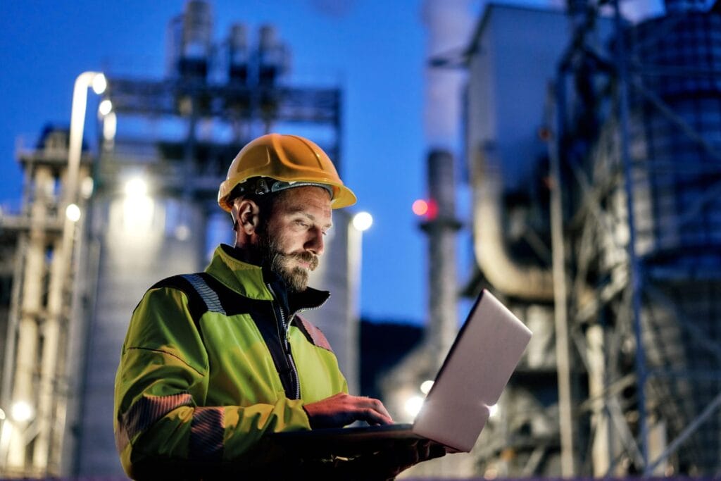 engineer with laptop at power plant